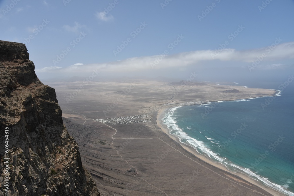 Coastal landscape with wavy sea and sandy beaches captured from cliffs