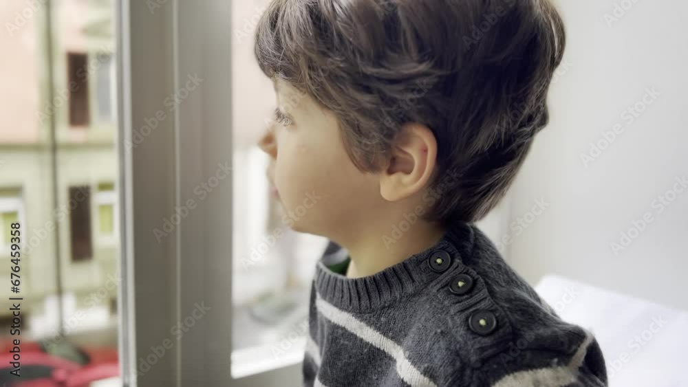 Peaceful Observation: Boy Enjoys Healthy Snack by Toy Corner, Watching Street Activity from Window Peaceful Observation: Boy Enjoys Healthy Snack by Toy Corner, Watching Street Activity from Window