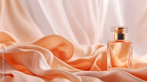 Beautiful and luxurious perfume bottle on a folded orange silk fabric background for product presentation with space for text. Product mockup