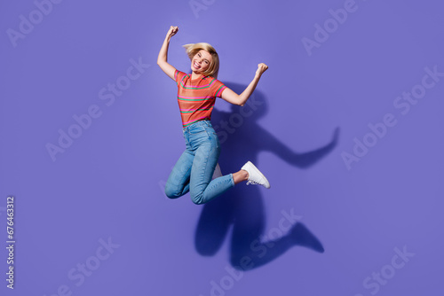 Full size body photo of young student jumping she approved to university the most intelligent teenager isolated on violet color background