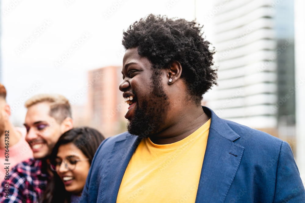 Young multi ethnic friends having fun together hanging out in the city - Friendship and diversity concept Young multi ethnic friends having fun together hanging out in the city - Friendship and diversity concept