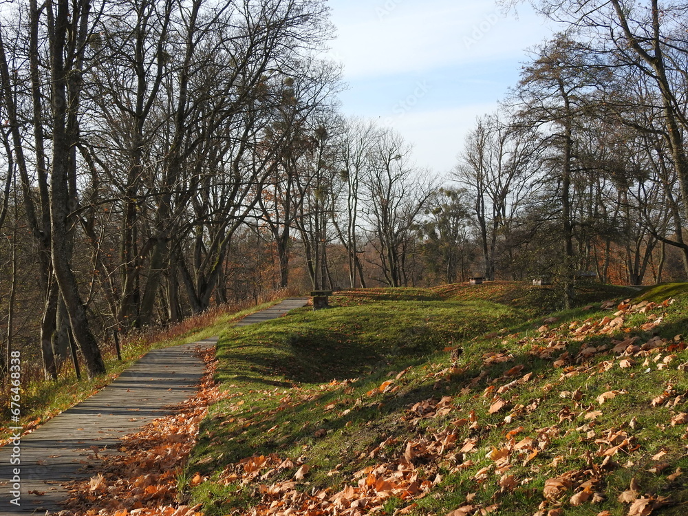 path in autumn park in donhof fort in kaliningrad, russia