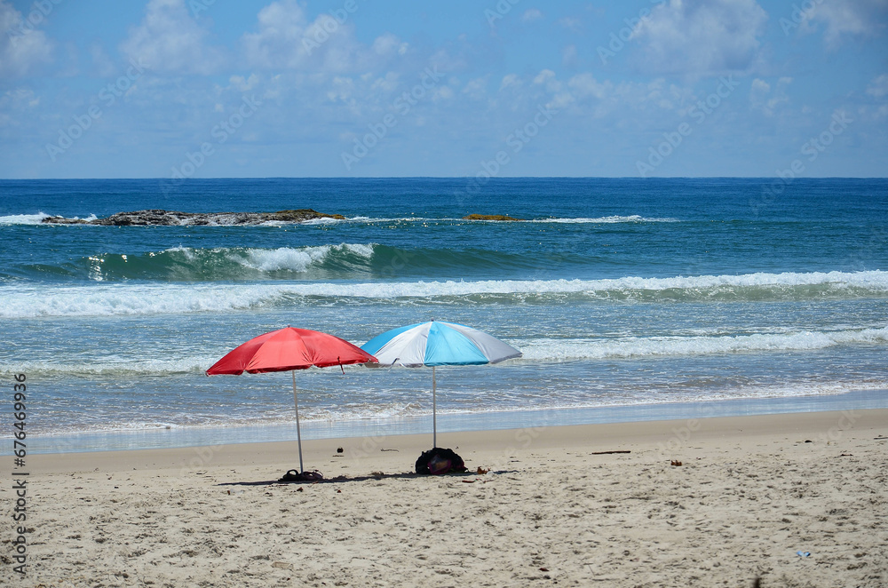 Couple umbrellas on the beach in a calm day