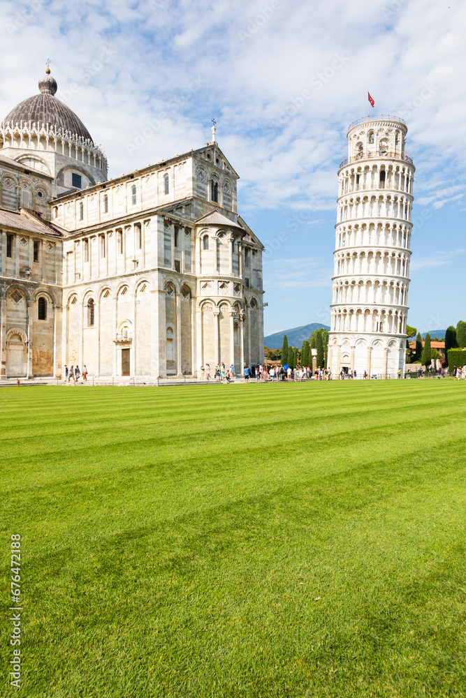 Pisa, Italy - Famous Leaning Tower landmark with blue sky, Renaissance white marble