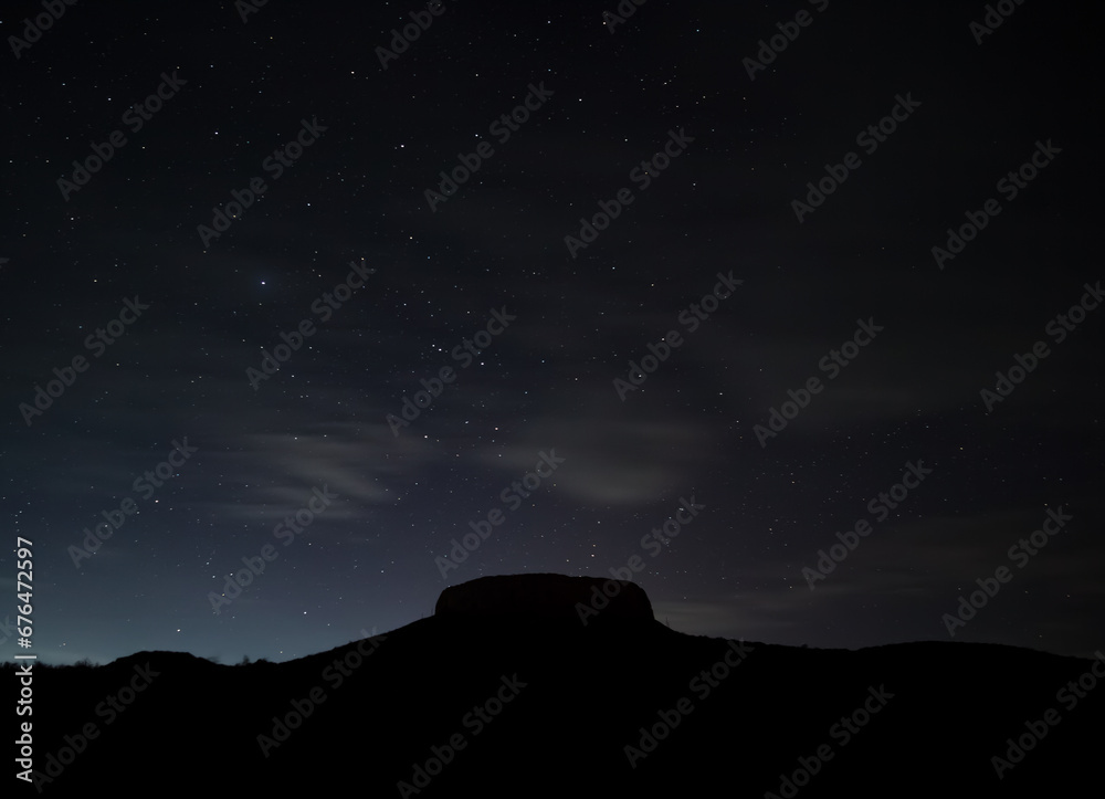 Zoroastrian fortress Chilpyk at night on the mountain against the background of the starry night sky in the desert Zoroastrian fortress Chilpyk at night on the mountain against the background of the starry night sky in the desert