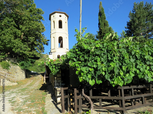 Church tower of Palaio Kostarazi Martyric Village in Northern Greece photo