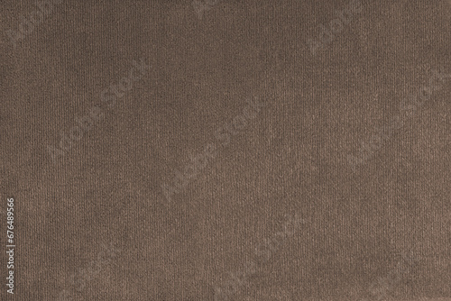 Texture background of velours brown fabric. Upholstery texture fabric, velvet furniture textile material, design interior, decor. Fleecy fabric texture close up, backdrop, wallpaper. photo