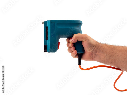 Electric stapler on a white background. Electric staple gun close-up.