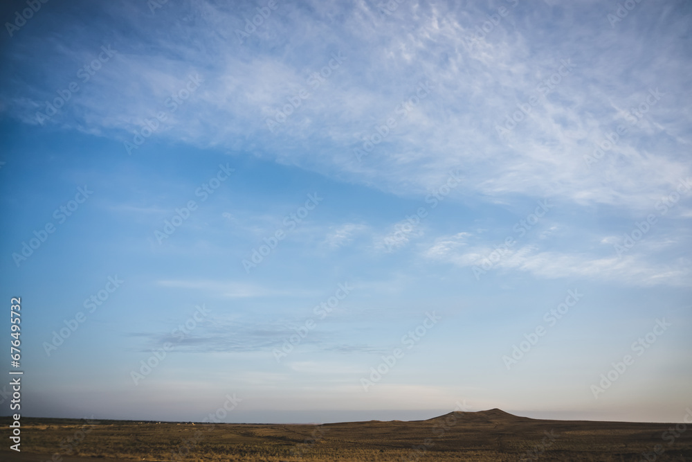 Minimalistic evening sky with clouds in the evening in the desert