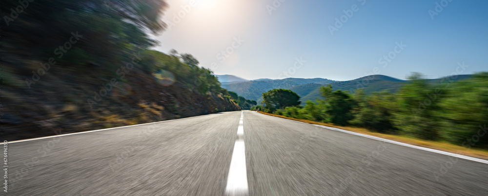 Mediterranean sea coast road into mountains horizon in summer with beautiful bright sun rays