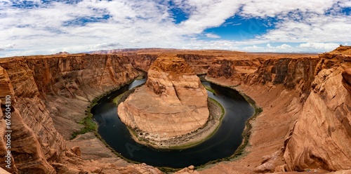 Fotografie Aerial shot of the beautiful Horseshoe Bend in Arizona under the blue cloudy sky