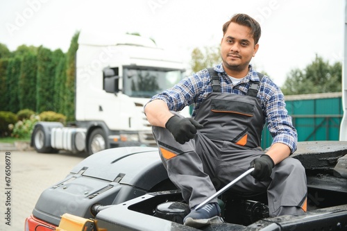 Indian Mechanic repairing the truck