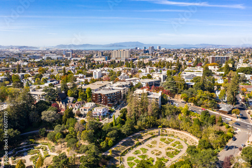 Aerial images over the hills of Oakland, California with a community of apartments on a beautiful summer day