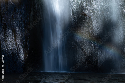 Waterfall breaking in the water with rainbow