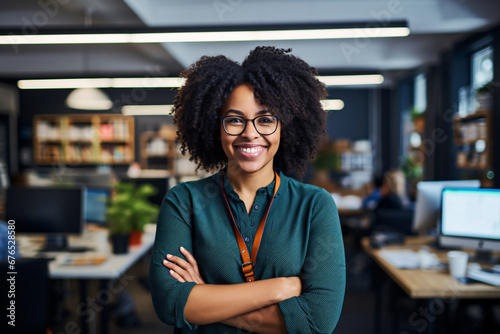 Portrait of a black confident businesswoman, female employee or business owner in her workspace