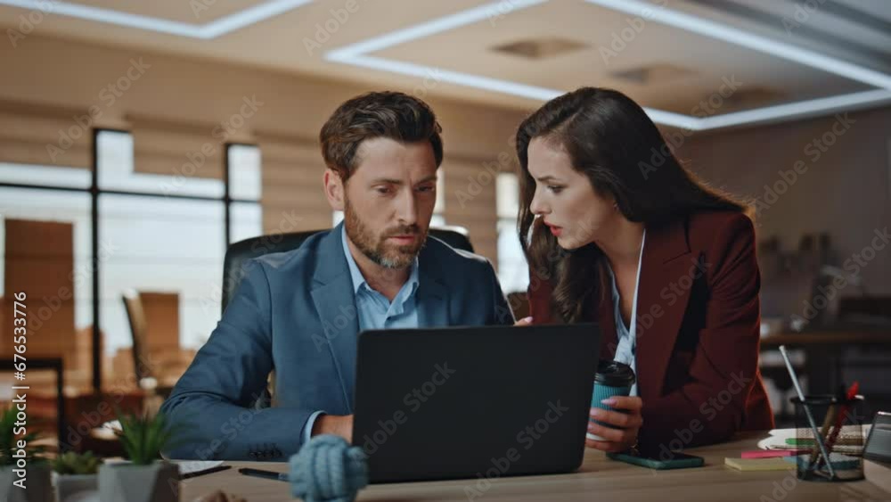 Serious colleagues checking project results agency closeup. Business team work Serious colleagues checking project results agency closeup. Business team work