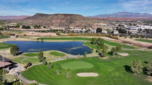 Aerial golf course clubhouse to lake St George Utah. Southwestern desert. Fastest growing housing markets. Retirement outdoors exercise recreation. Economic strength surge in home building. Wealth. photo