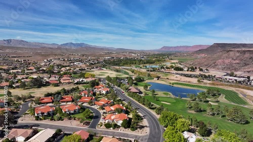 Aerial residential golf course and lake St George . Southwestern desert. Fastest growing housing markets. Retirement and outdoors exercise recreation. Economic strength surge in home building. Wealth. photo