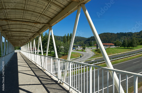 the A8 Cantabrian highway with three lanes in each direction seen from the pedestrian walkway photo