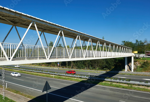 pedestrian walkway over the A8 Cantabrian highway with three lanes in each direction  photo