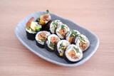 Sushi roll japanese food style on wooden table background.