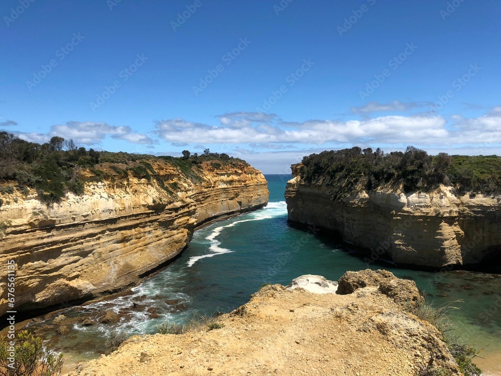 Beautiful view of cliffs and sea against the background of blue sky. Great Ocean Road, Australia.