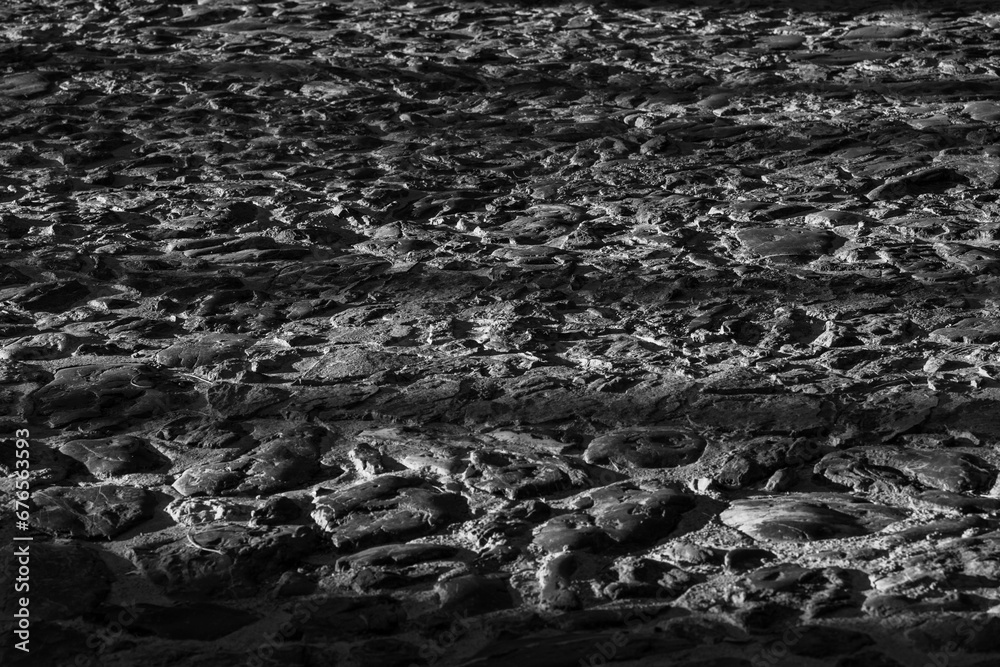 Black and white, shadows and light. Contrast. Scene. Stone surface. Pattern and texture. Monochrome. Black and white, shadows and light. Contrast. Scene. Stone surface. Pattern and texture. Monochrome.