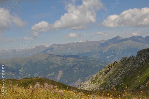 Beautiful landscape of the big mountains of the Alps in Italy under the blue sky on a sunny day