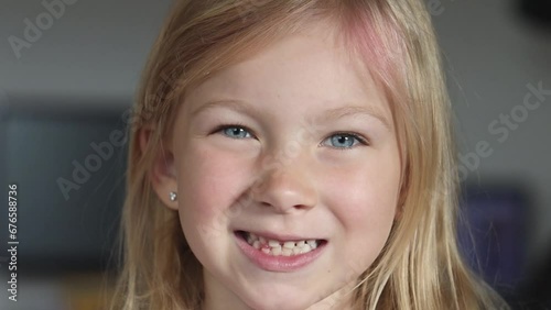 child is trying to get rid of a missing tooth.