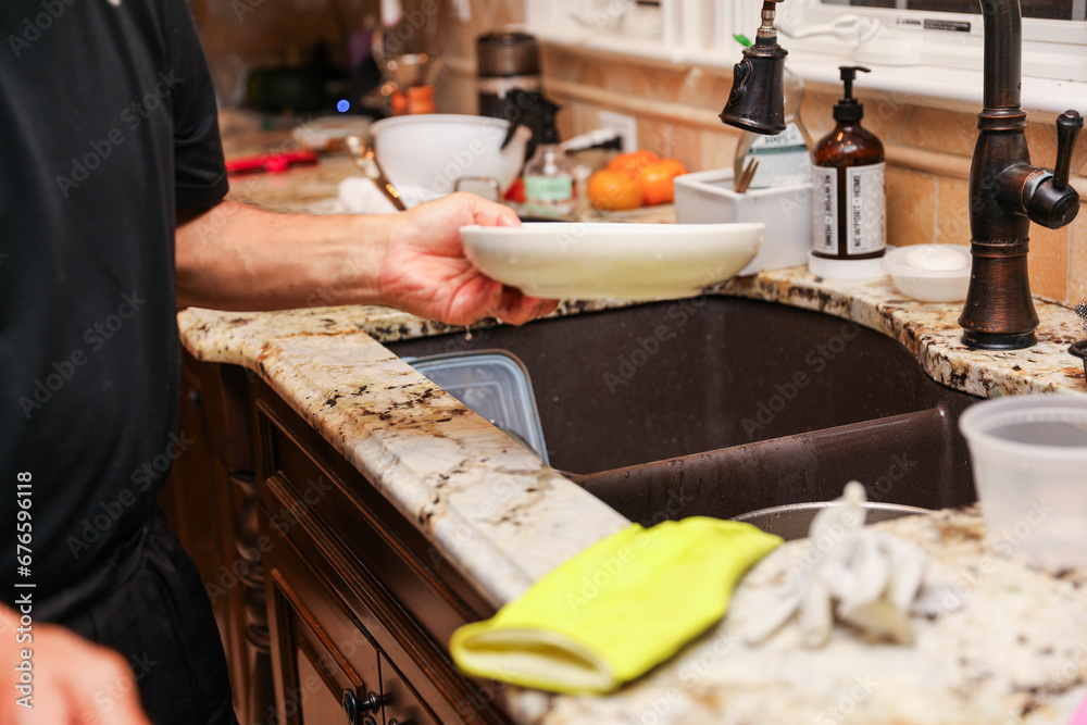 handwashing dishes, symbolizing equality and shared responsibilities