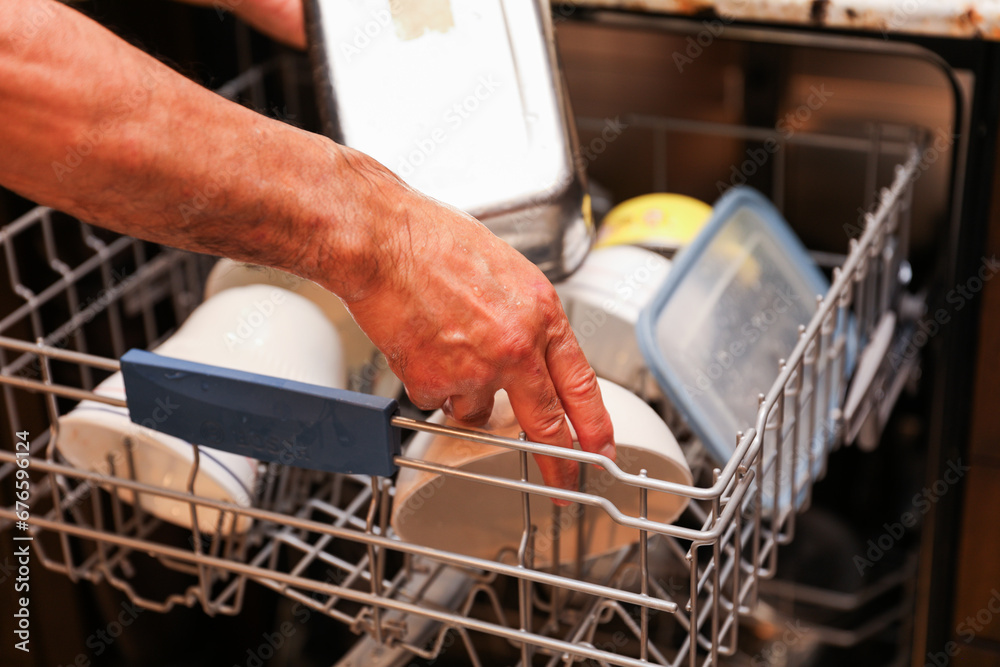 handwashing dishes, symbolizing equality and shared responsibilities