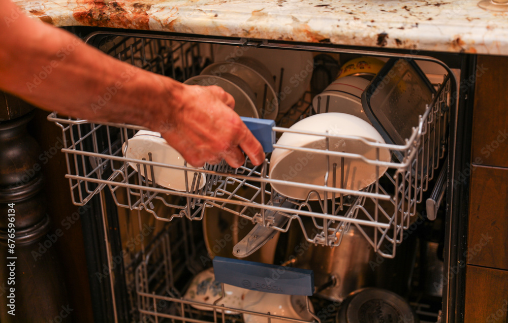 handwashing dishes, symbolizing equality and shared responsibilities