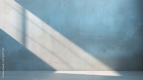 Abstract light gray blue background  perfect for product presentations. Shadows and light from the window on the cement wall Morning light enters through the diagonal window.