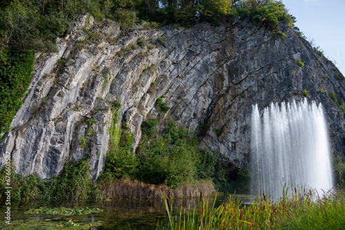 Big fontain by rock, walking in smallest medieval town in world Durbuy on river Ourthe, Ardennen, Belgium photo