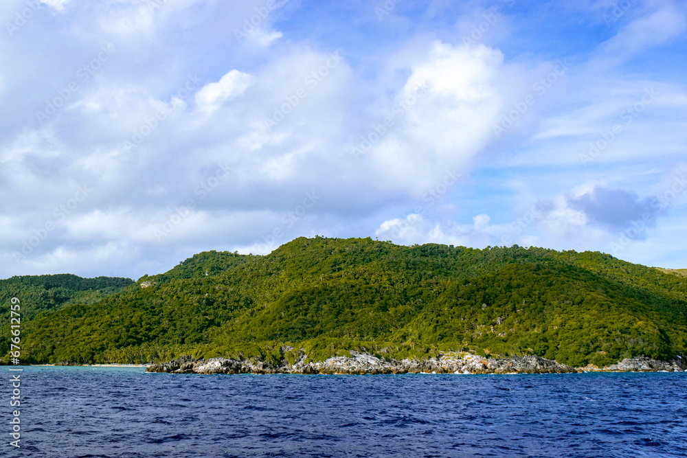 Tropical islands on a sunny, blue sky. Romblon Island, Philippines