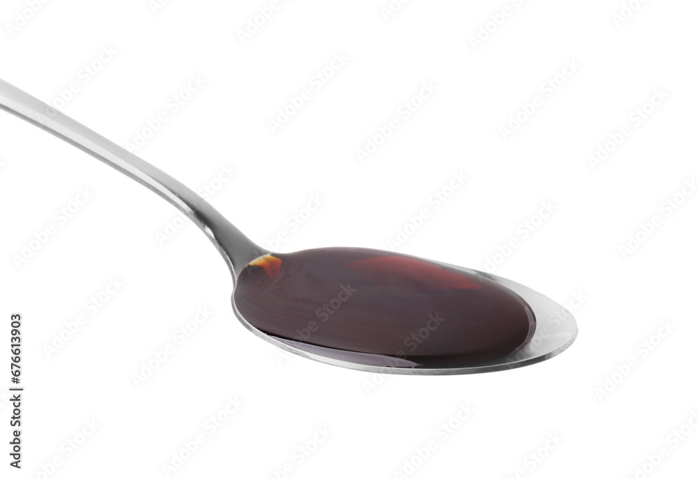 Spoon with delicious caramel syrup isolated on white Spoon with delicious caramel syrup isolated on white