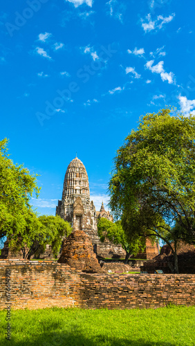 Ruins of an old brick wall at the Religious Historical Park..Wat Phra Ram in the Ayutthaya period was the capital..scenery sunrise white cloud in blue sky .It's like being in a historical era © Narong Niemhom