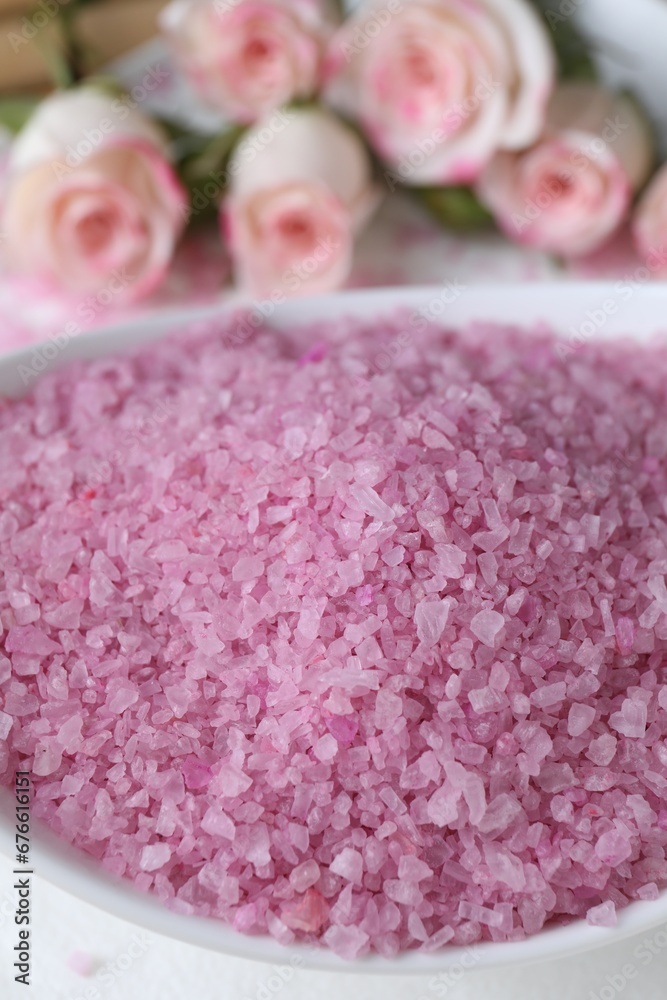 Bowl with pink sea salt on blurred background, closeup Bowl with pink sea salt on blurred background, closeup