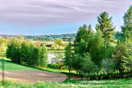 Landscape with lake  forest and meadow in sunny day  Poland.