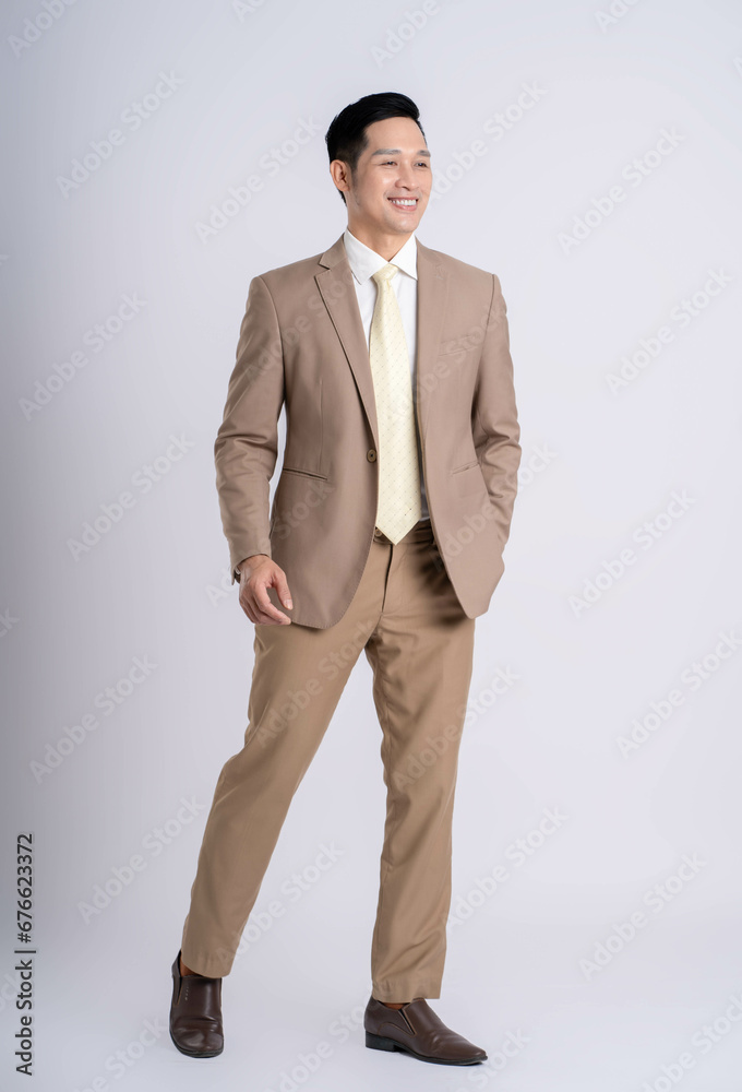fullbody of a successful businessman posing on a white background fullbody of a successful businessman posing on a white background