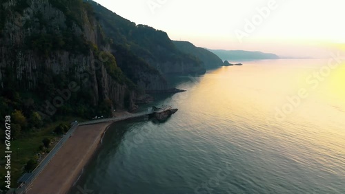 Lava landscape and the Black Sea. Guzelcehisar is famous for its lava basalt columns. The columns were viewed with a drone at sunset. Amasra, Bartin, Turkey photo