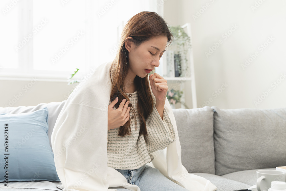 Unforeseen Discomfort: A Woman Experiences a Sudden Cough, Close-up of a woman coughing and feel chest pain. Unforeseen Discomfort: A Woman Experiences a Sudden Cough, Close-up of a woman coughing and feel chest pain.