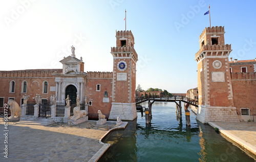 Entrance to the Venetian Arsenal with its permanent guard of marble lions.  The Venetian Arsenal is a complex of former shipyards and armories clustered together in the city of Venice.  © vlad_g