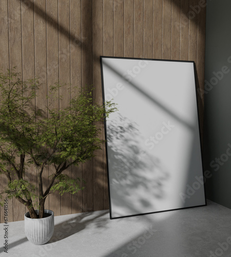 big wooden frame mockup poster leaning on the wooden panel wall with tree plant decoration