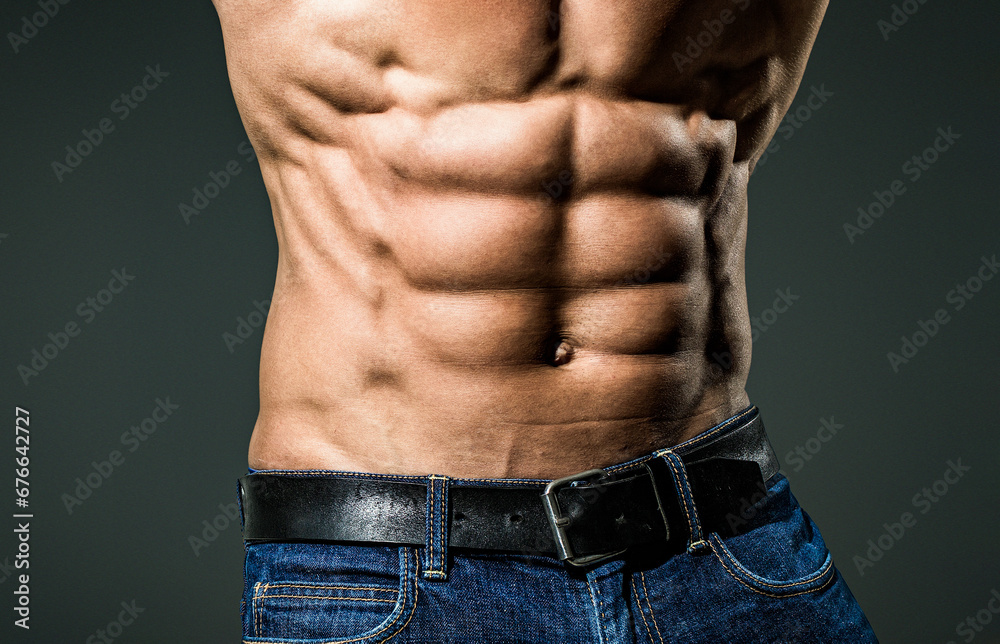 Sexy muscular handsome topless male model. Muscular body. Muscular man. Male body shape, strong man. Closeup Male chest. Chest muscles. Muscled male torso with abs. Sexy muscular handsome topless male model. Muscular body. Muscular man. Male body shape, strong man. Closeup Male chest. Chest muscles. Muscled male torso with abs.
