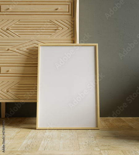 50x70 frame mockup leaning on the wooden cabinet for your art presentaion photo