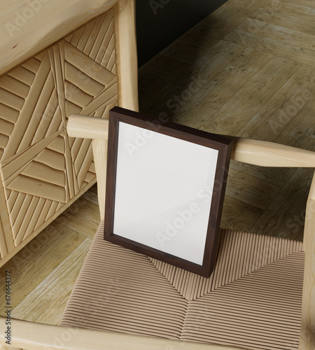 20x25 cm frame mockup photo on the woden chair in the living room photo