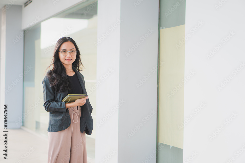 Beautiful Asian businesswoman crossed arms looking at the camera. Beautiful Asian businesswoman crossed arms looking at the camera.