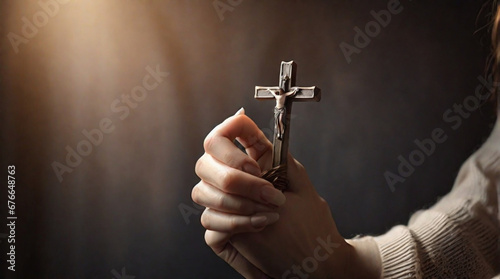 hand holding a cross