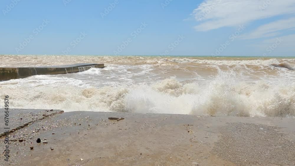 View of waves splashing at shore on beach. Beautiful closeup view of storm in seascape against sky in summer. Concept of powerful nature during sunny day. View of waves splashing at shore on beach. Beautiful closeup view of storm in seascape against sky in summer. Concept of powerful nature during sunny day.